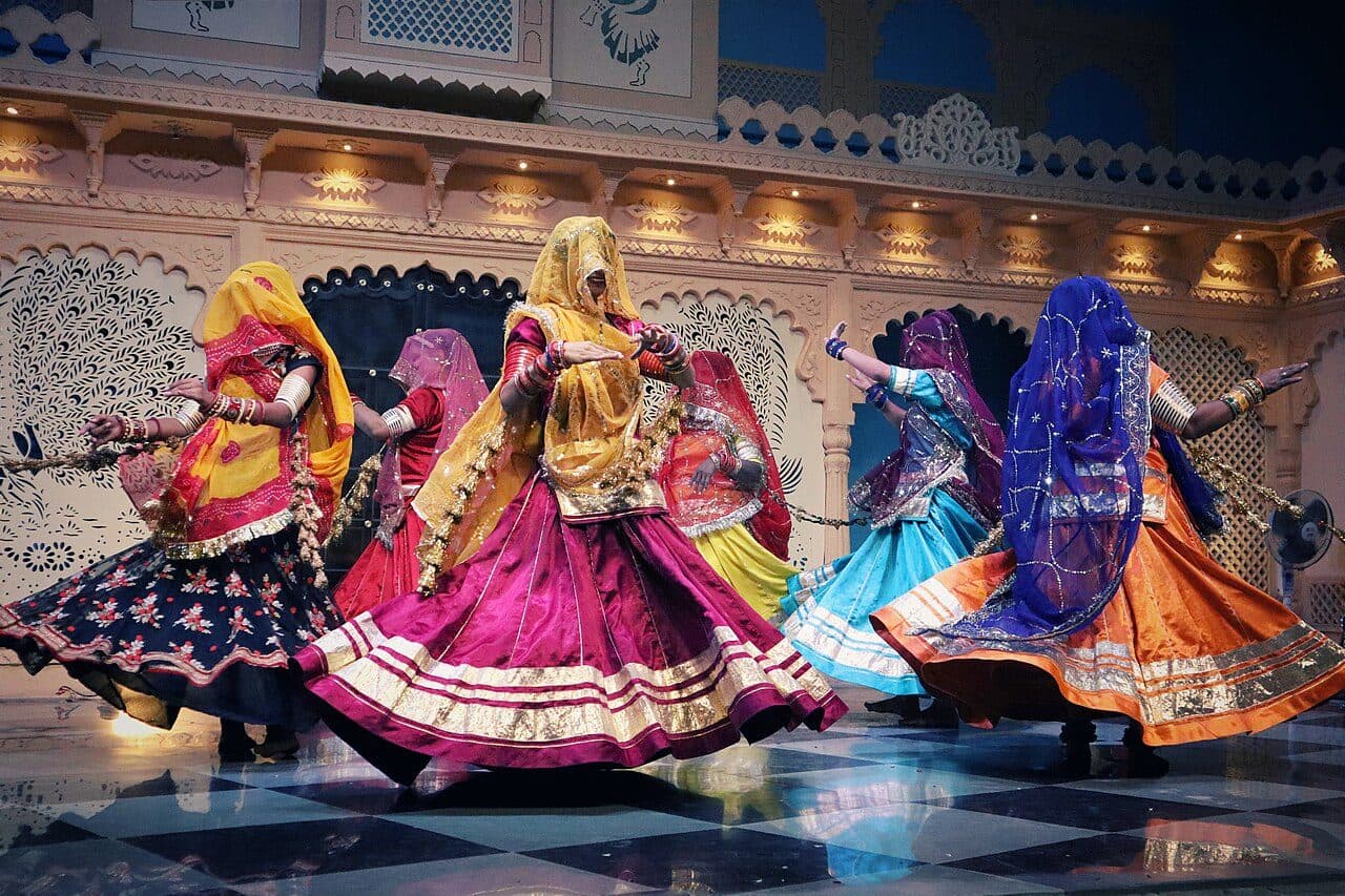 Women turning in Ghoomar, lehengas in a wide circle