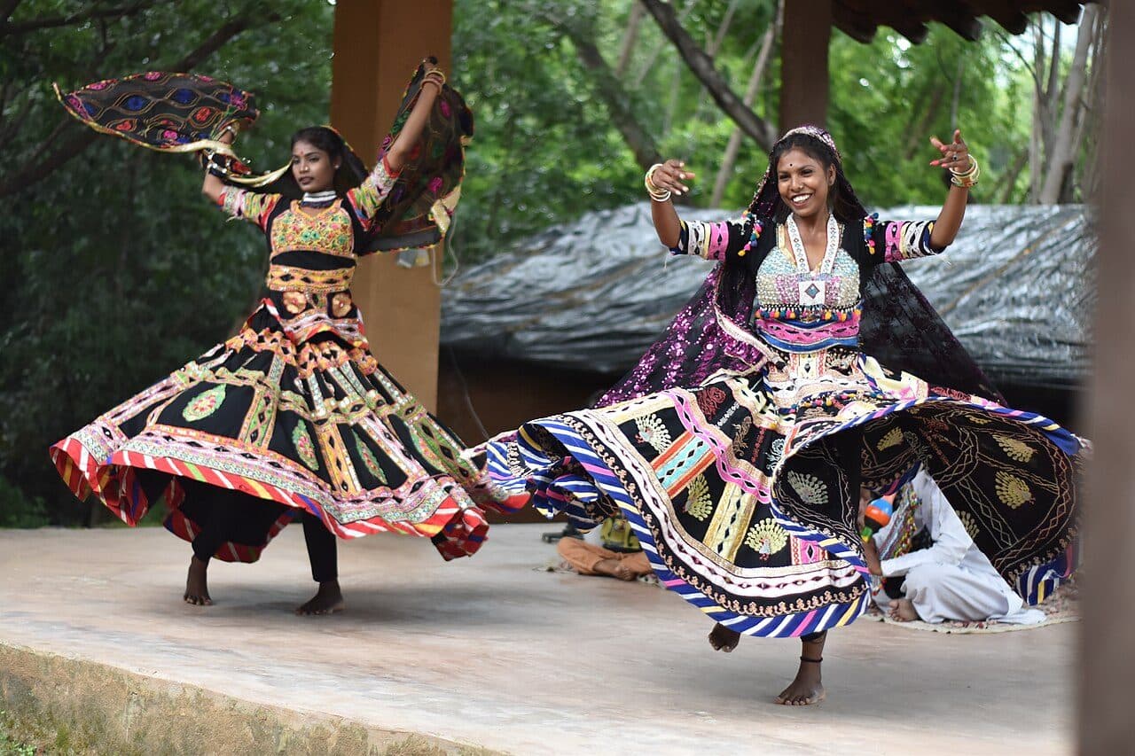 Kalbelia dancers in swirling embroidered lehengas
